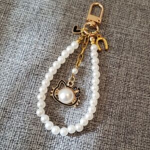 Elegant Pearl Gold Cat Bag Charm